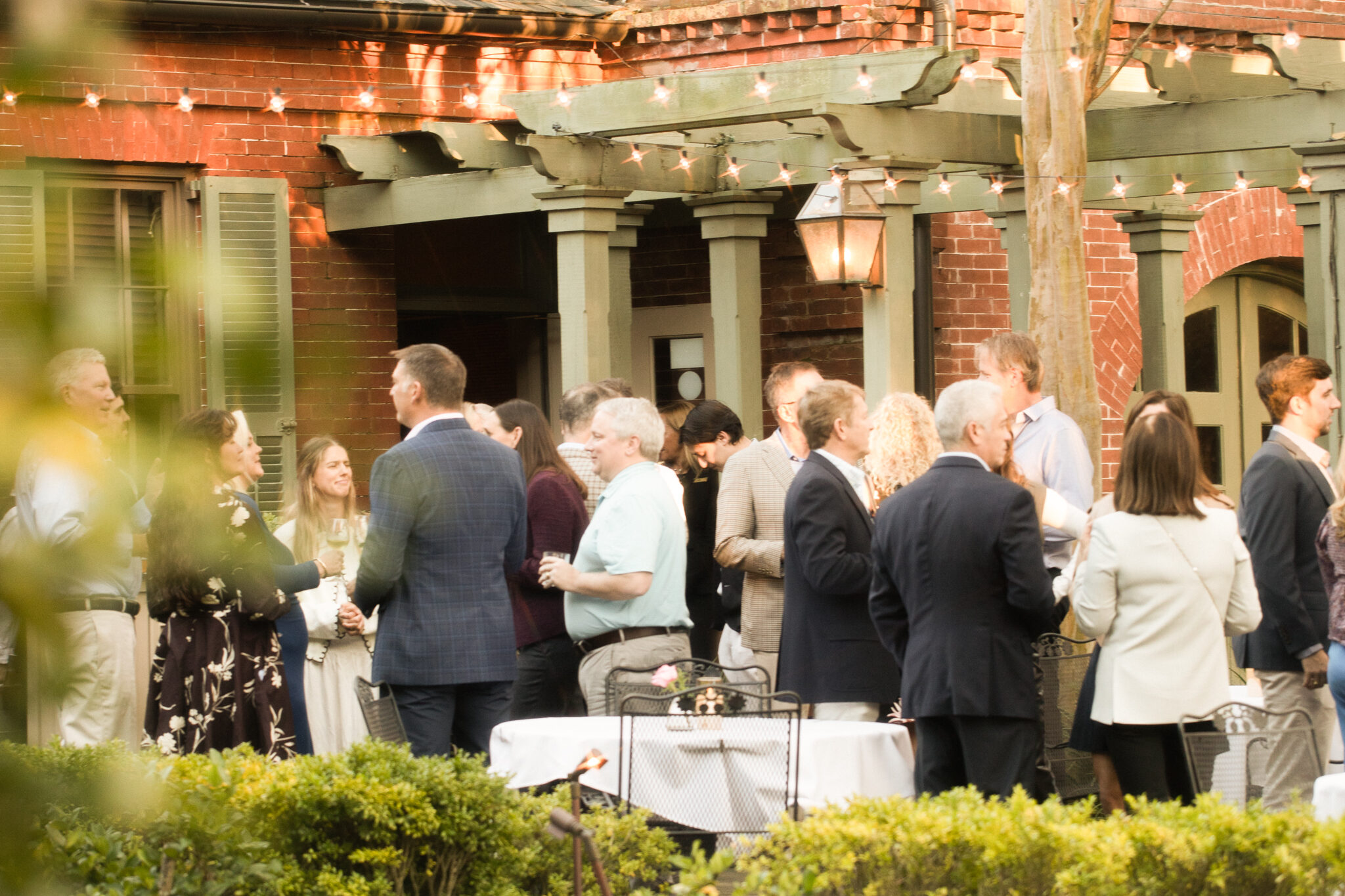 people gathering outdoors on the circa 1886 patio